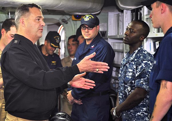 Vice Adm. Tom Copeman, commander of Naval Surface Forces, and commander, Naval Surface Forces, U.S. Pacific Fleet, meets Sailors aboard the Hawaii-based guided-missile cruiser USS Port Royal (CG 73) during a tour of the ship in November. U.S. Navy Photo