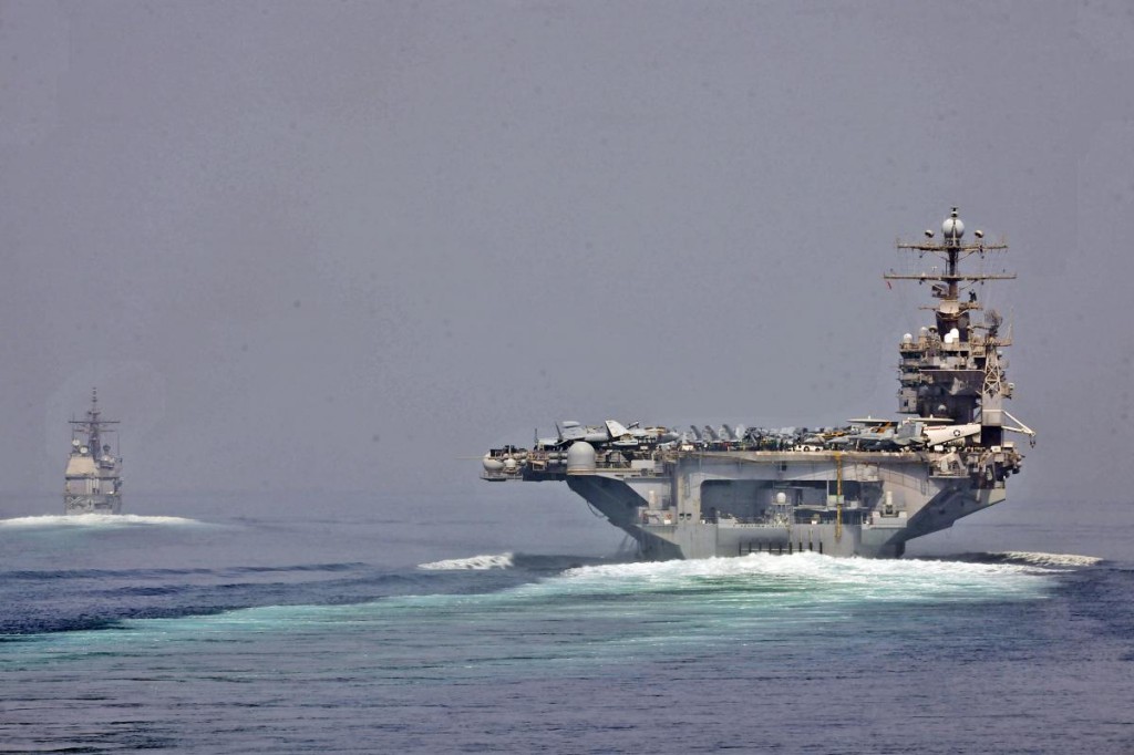 U.S. Navy photo of the USS Enterprise and USS Cape St. George transitioning through the Strait of Hormuz on May 11.