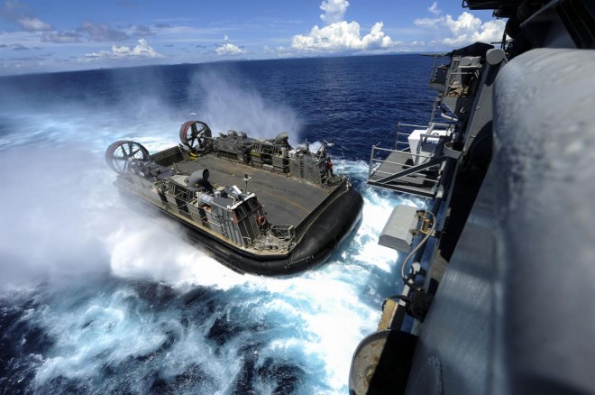 A landing craft air cushion enters the welldeck of the amphibious assault ship USS Bonhomme Richard (LHD 6) to reload Marines and equipment for a certification exercise. Sept. 2, 2012U.S. Navy Photo