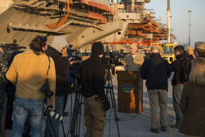 Rear Adm. Kevin Sweeney, commander of the Harry S. Truman Strike Group, addresses the media on the pier alongside the aircraft carrier USS Harry S. Truman (CVN 75) on Wednesday. US Navy Photo