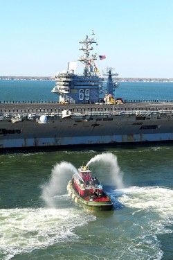 he aircraft carrier USS Dwight D. Eisenhower (CVN 69) makes its approach pierside at Naval Station Norfolk after a six-month deployment to the U.S. 5th and 6th Fleet areas of responsibility. US Navy Photo