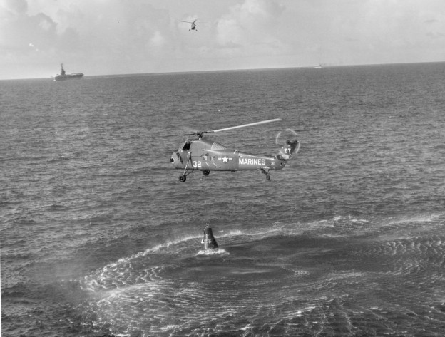 A Marine helicopter lifts Liberty Bell 7 after recovering astronaut Gus Grissom, July 21, 1961. The helicopter was forced to release the capsule and allow it to sink after it became flooded with seawater. Liberty Bell 7 was recovered from the ocean floor in 1999. US Naval Institute Archives
