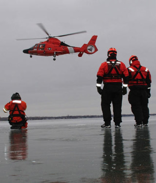 Coast Guardsmen from Air Station Detroit and Station St. Clair Shores, Mich., conduct joint ice-rescue training on Lake St. Clair, Feb. 12, 2013. US Coast Guard Photo 