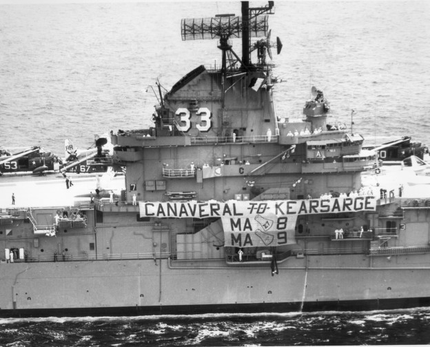 The USS Kearsarge celebrates its role in astronaut recovery with a banner, May 18, 1963. US Naval Institute Archives