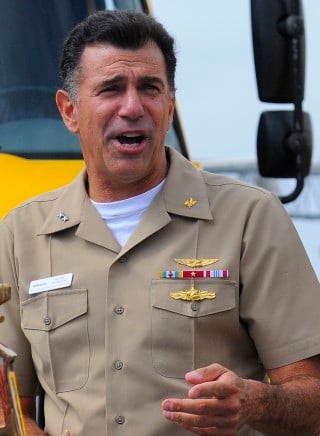 Rear Adm. Mark F. Heinrich, commander, of Fleet and Industrial Supply Centers, address members of the Naval Air Station North Island in 2011. US Navy Photo