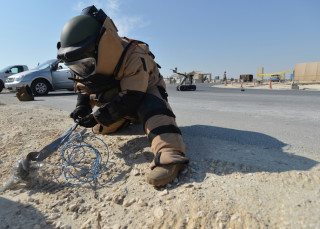 A Navy explosive ordnance disposal sailor disables an explosive device during a Nov. 12, 2012 exercise in US Central Command, US Navy Photo
