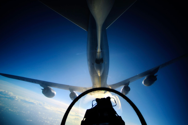A U.S. Air Force KC-135 Stratotanker refuels an F-16 Fighting Falcon over the Pacific Ocean in 2012. US Air Force Photo