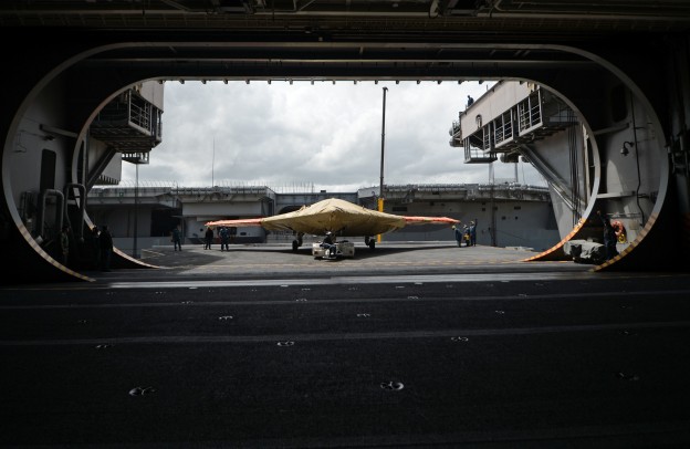 An X-47B Unmanned Combat Air System (UCAS) demonstrator sits on an aircraft elevator of the aircraft carrier USS George H.W. Bush (CVN-77) on May 6. 
