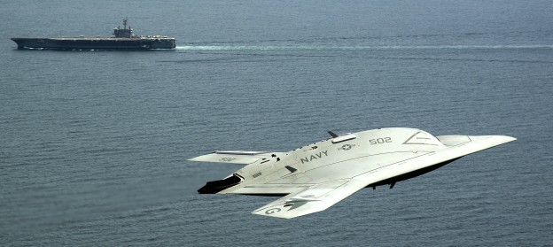 Unmanned Combat Air System (UCAS) demonstrator flies near the aircraft carrier USS George H.W. Bush (CVN-77). George H.W. Bush on May 14, 2013. US Navy Photo