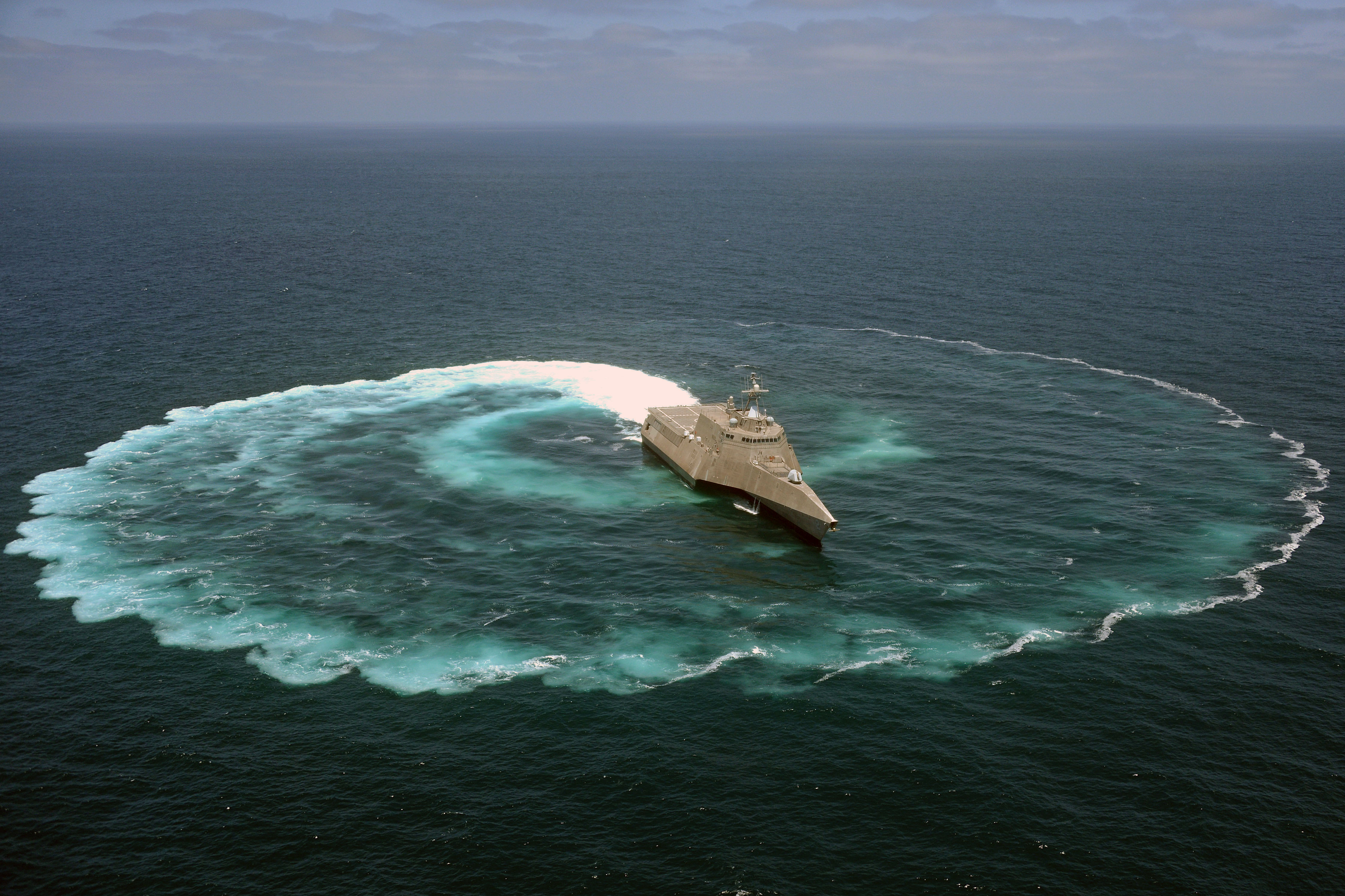 The littoral combat ship USS Independence (LCS 2) demonstrates its maneuvering capabilities in the Pacific Ocean on July 18, 2013. US Navy Photo