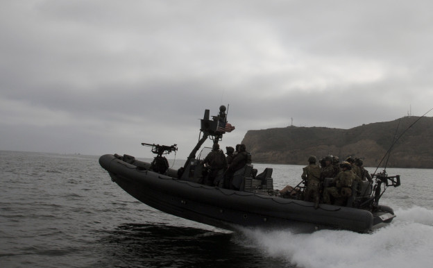 Navy SEALs assigned to a west coast based SEAL Team and Special Warfare Combatant-craft Crewmen (SWCC) from Naval Special Warfare Boat Team (SBT) on May 23, 2012. 