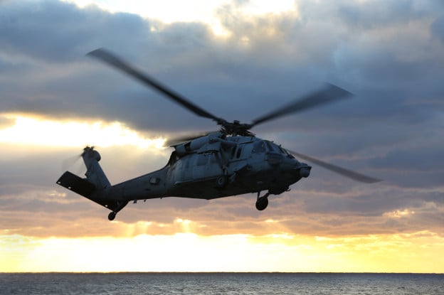  MH-60S Knighthawk from Helicopter Sea Combat Squadron 28 departs the flight deck of the amphibious assault ship USS Kearsarge (LHD-3) in January.