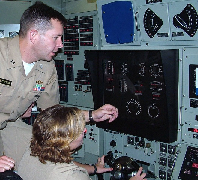 Lt. Thomas Belchik trains Midshipman 1st Class Elizabeth Byers in 2009. US Navy Photo