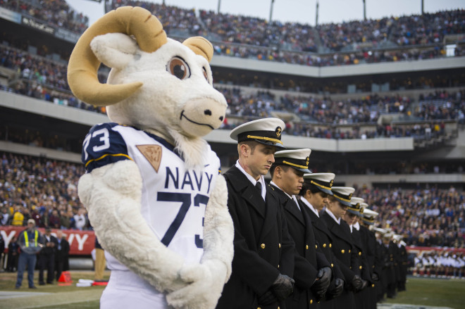 Naval Academy mascot Bill the Goat stands with midshipmen during the 2012 Army-Navy Game. US Navy Photo