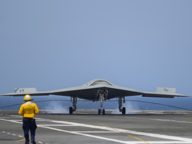 An X-47B Unmanned Combat Air System (UCAS) demonstrator completes an arrested landing on the flight deck of the aircraft carrier USS George H.W. Bush (CVN-77) on July, 10 2013. US Navy Photo