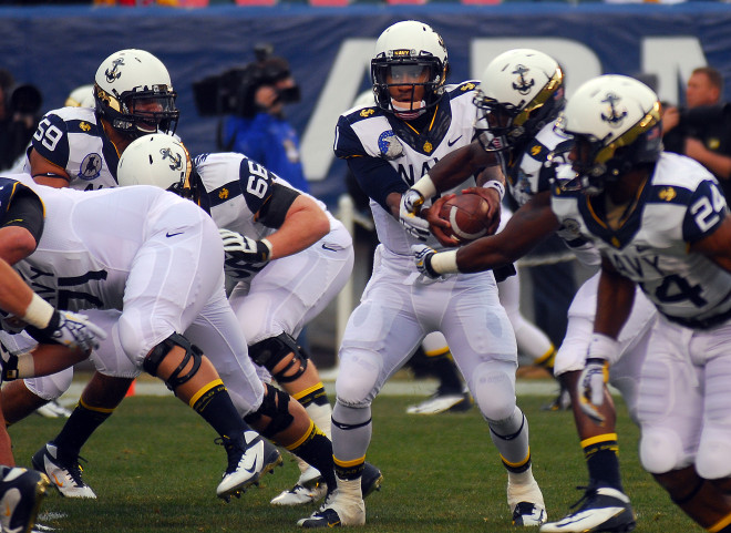 U.S. Naval Academy quarterback Trey Miller (1) hands off the football during the 113th Army-Navy Football game at Lincoln Financial Field in 2012. US Navy Photo