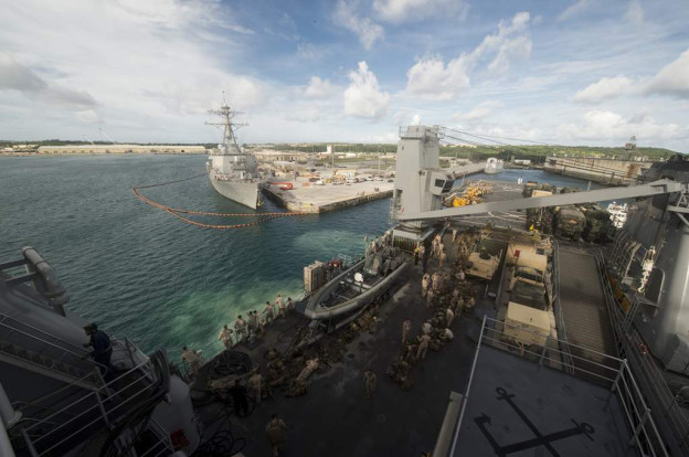 Marines prepare to disembark amphibious dock landing ship USS Harpers Ferry (LSD-49) in Guam on Sept. 12, 2013. US Navy Photo
