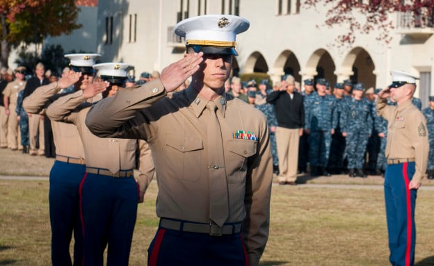Capt. Michael DiFelice salutes during the playing of the national anthem at the 238th US Marine Corps Birthday. US Navy Photo