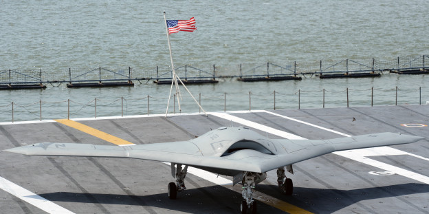 X-47B Unmanned Combat Air System (UCAS) demonstrator taxies on the flight deck of the aircraft carrier USS George H.W. Bush (CVN-77) in May 2013. US Navy Photo 