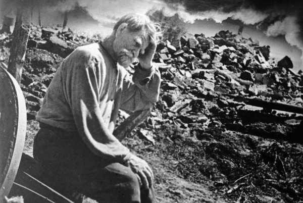 Elderly Ukranian man and his ruined home, Tschernigow region, Ukraine, June, 18 1943. Photo by K. Lishko, Russian International News Agency via World War II Database 