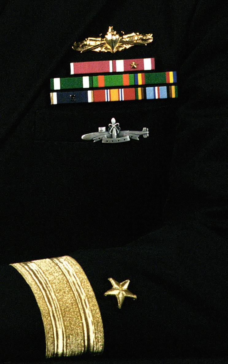 Rear Admiral (lower half) Robert E. Traister, USN (covered)