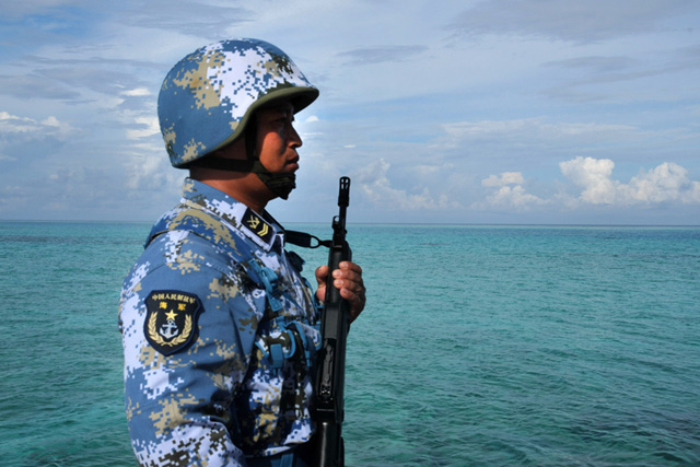 Chinese soldier near the Johnson South Reef. Xinhua Photo 
