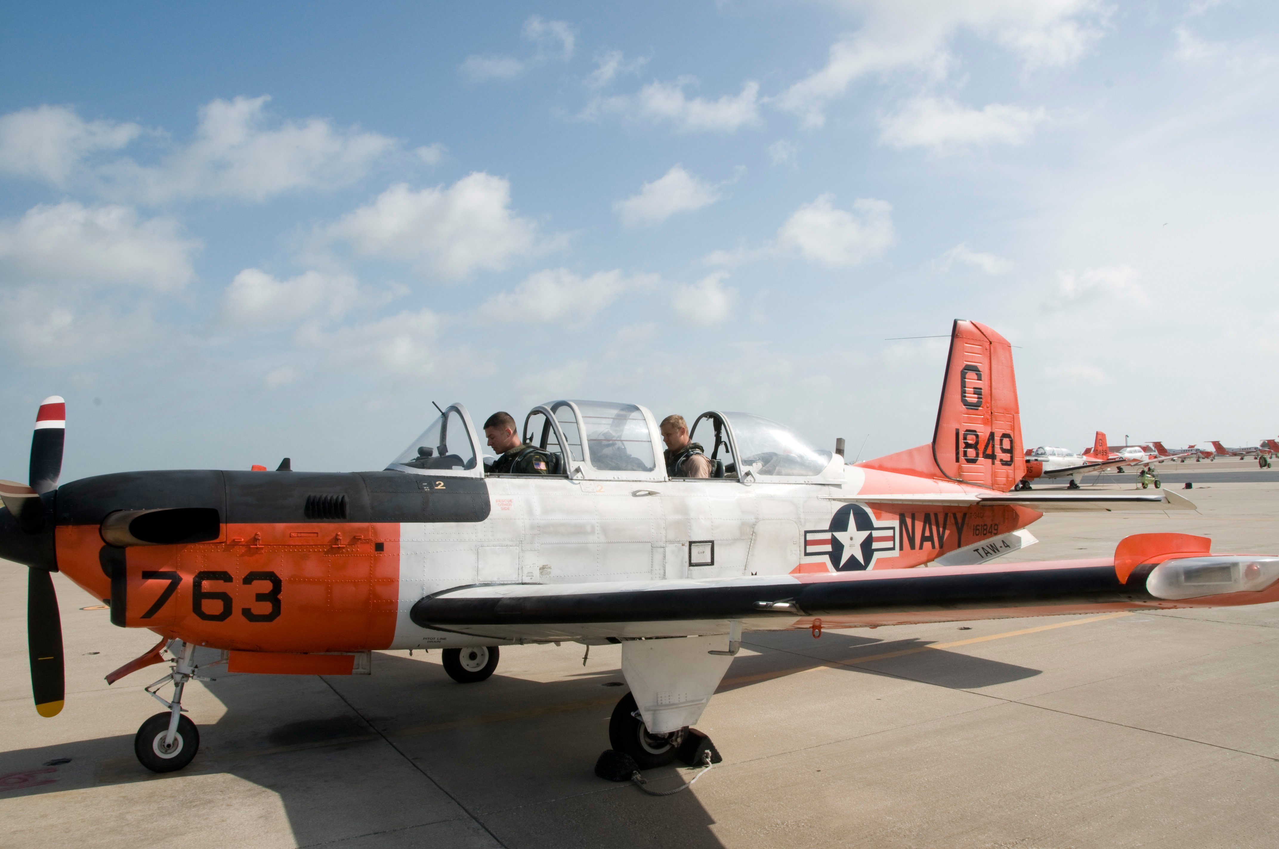 Two sailors in a T-34C Turbomentor before a training flight. US Navy Photo