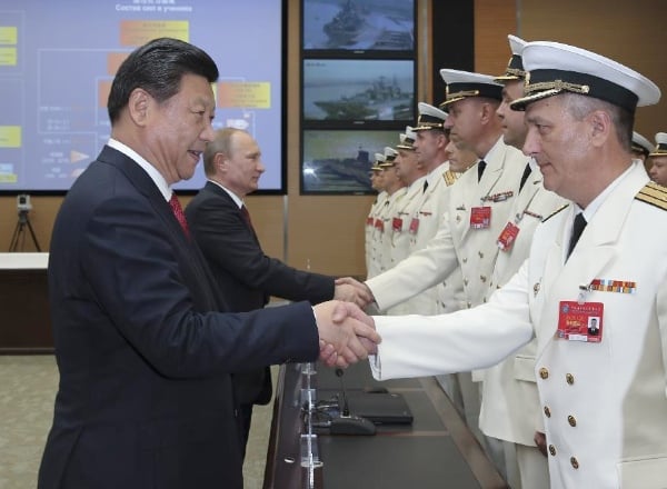 Chinese president Xi Jinping and Russian president Vladimir Putin greet participants of Joint Sea-2014 exercise at Wusong naval port in Shanghai, east China, May 20, 2014. Xinhua Photo