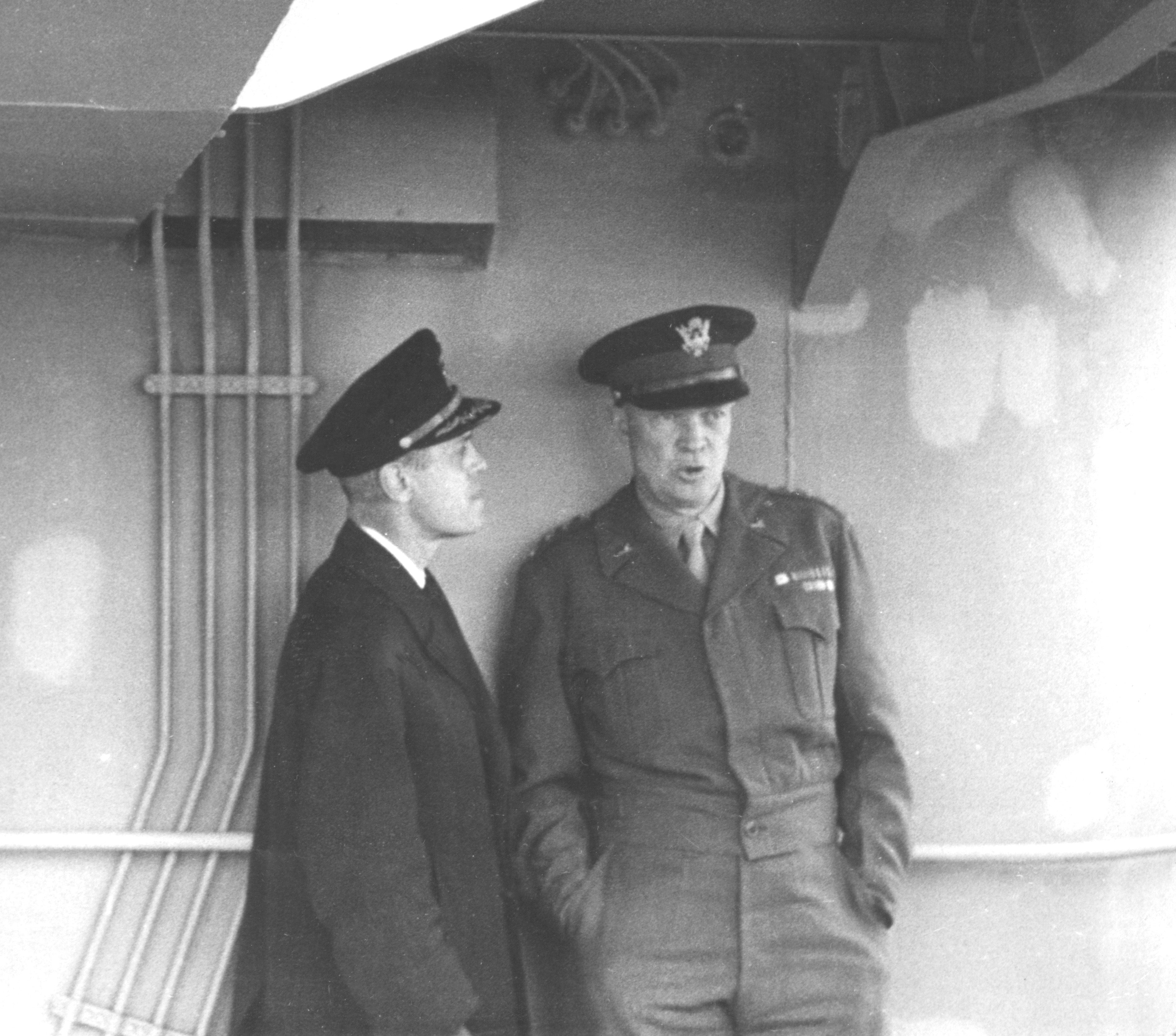 Naval Reserve Captain Edmond J. Moran receives urgent and specific instructions from Supreme Allied Commander Europe General Dwight D. Eisenhower on board the destroyer USS Thompson after D-Day. The general ordered Moran back to the United States “for more supplies and equipment to keep the invasion going.”