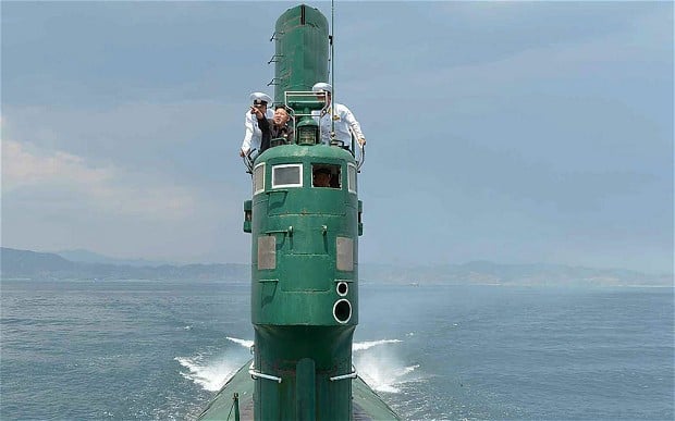 Kim Jong Un in the conning tower of what appears to be a Project 633 diesel submarine. KCNA Photo