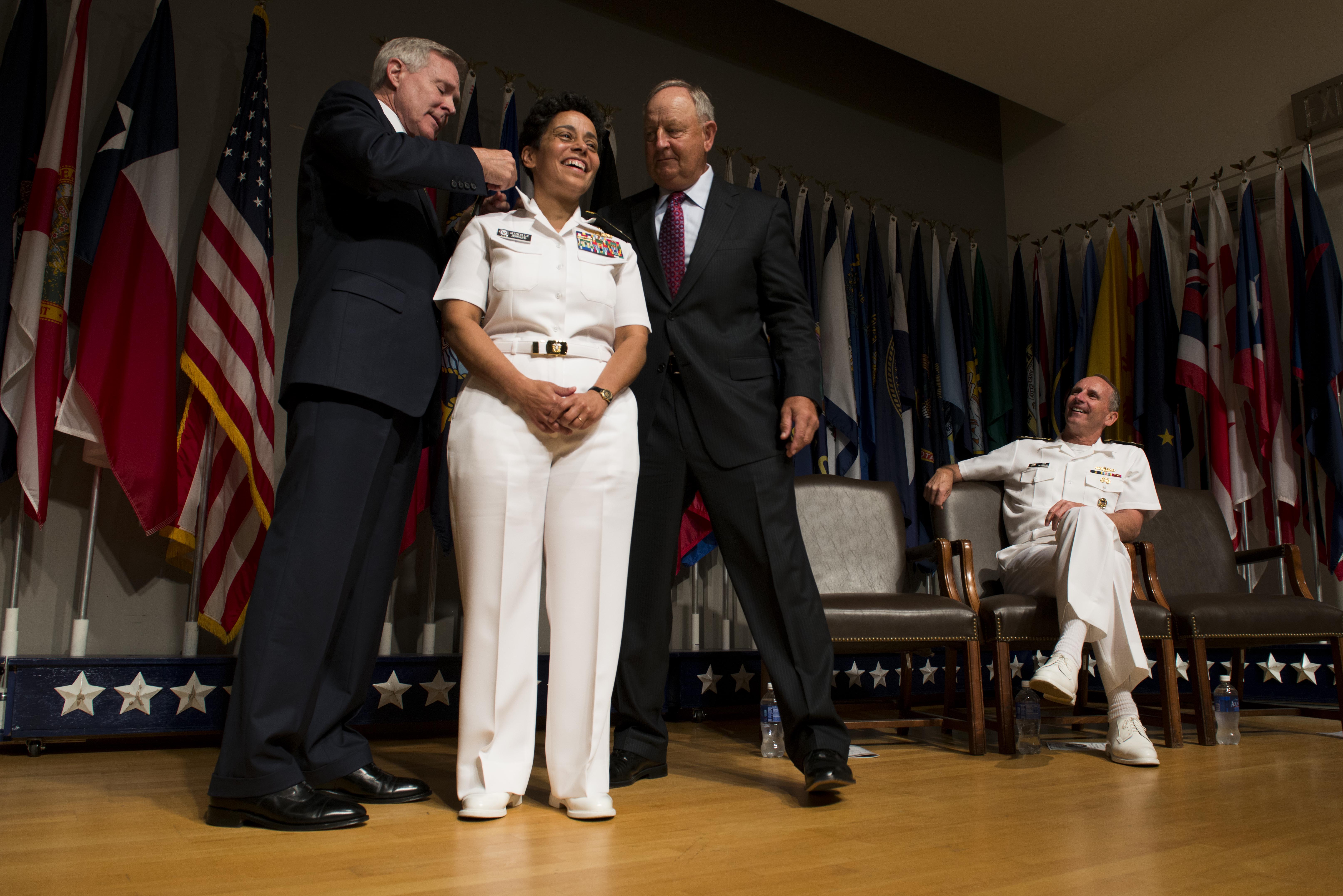 Secretary of the Navy (SECNAV) Ray Mabus, left, promotes Vice Adm. Michelle Howard to the rank of Admiral at the Women In Military Service For America Memorial in Arlington, Va. US Navy Photo