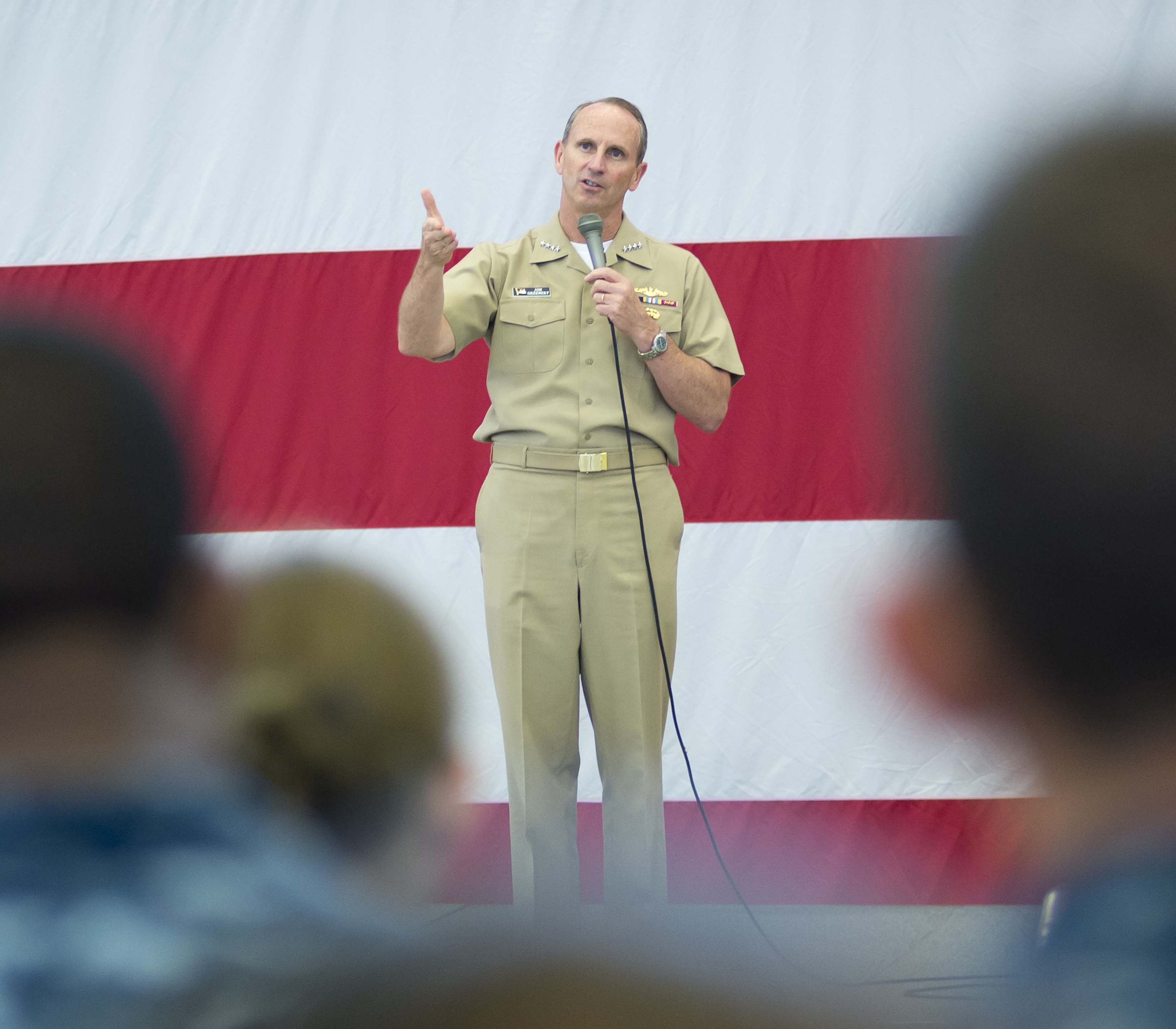 Chief of Naval Operations (CNO) Adm. Jonathan Greenert speaks to sailors, civilians and families during an all-hands call in the "Wash Rack" hangar bay at Naval Air Station Whidbey Island on Aug. 5, 2014. US Navy Photo