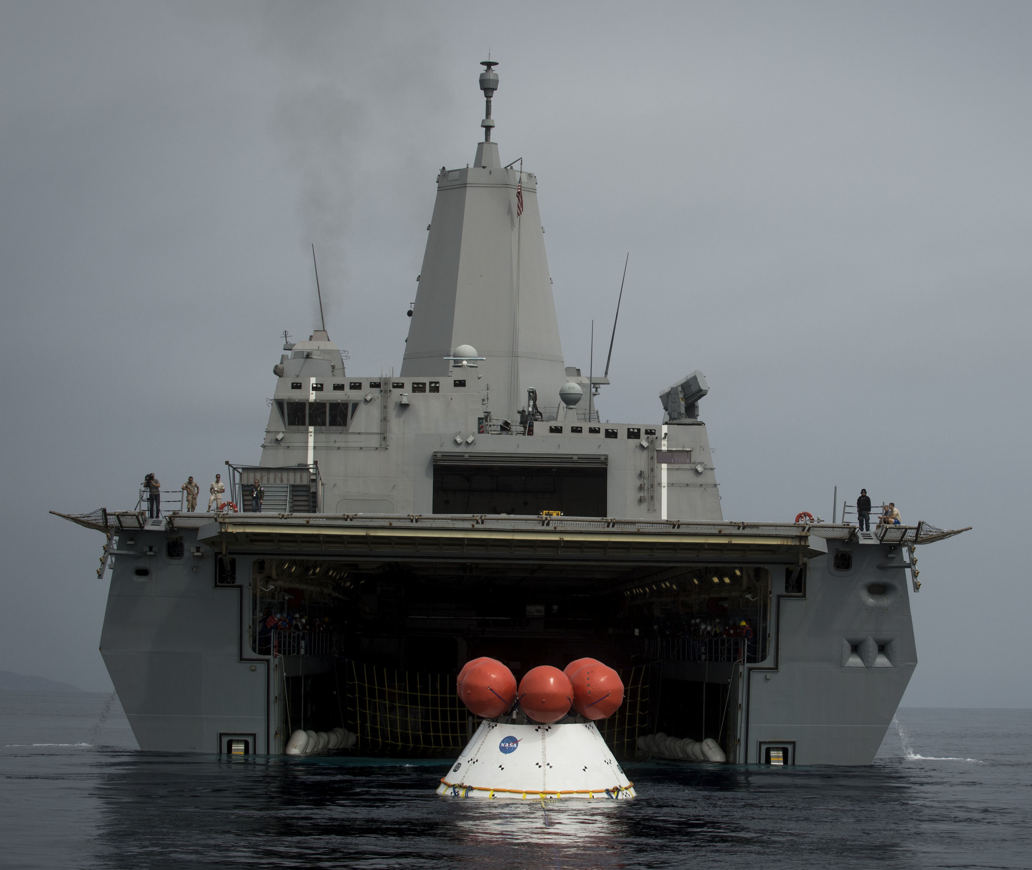 The Orion test capsule enters the welldeck of USS Anchorage (LPD-23) as part of ongoing testing. US Navy Photo 