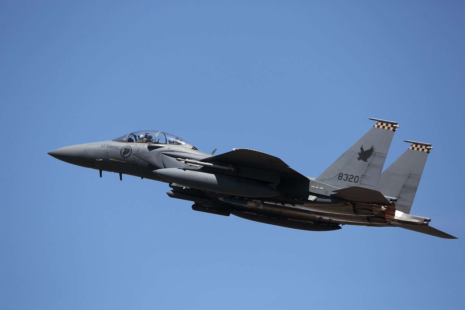 A Republic of Singapore Air Force Boeing F-15SG Eagle takes off from Royal Australian Air Force Base Darwin, Australia during Exercise Pitch Black, August 2014 toting a practice GBU-38 Joint Direct Attack Munition (JDAM). Mike Yeo Photo