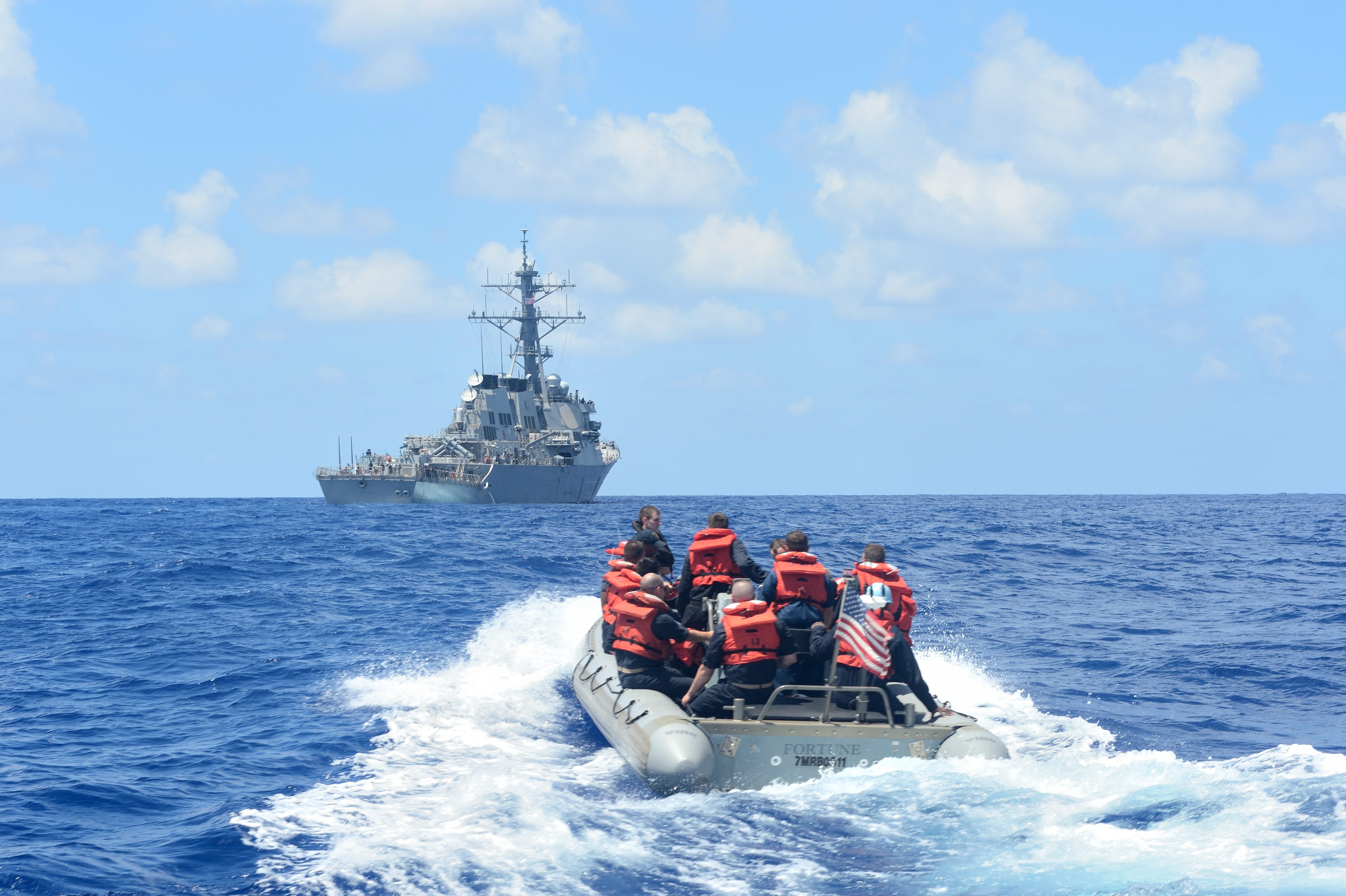 Sailors assigned to the Arleigh Burke-class guided-missile destroyer USS Ross (DDG 71) conduct small boat operations in a rigid-hull inflatable boat on Aug. 3, 2014. US Navy Photo