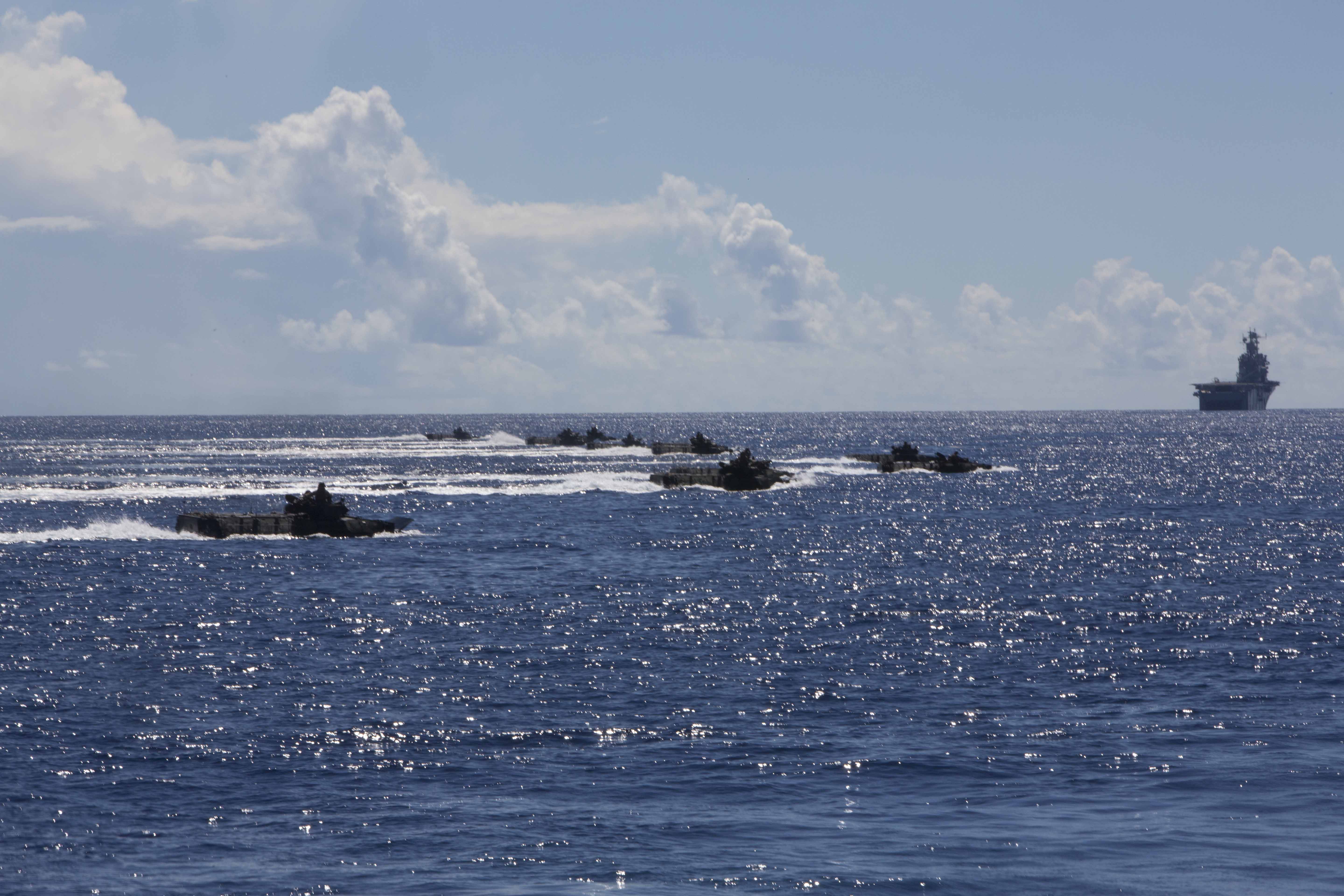 U.S. Marines with Company I, Battalion Landing Team 3rd Battalion, 5th Marines, 31st Marine Expeditionary Unit (MEU), conduct training with Navy Beach Unit 7 Vehicles as part of Amphibious Integration Training (AIT) at sea on Sept 4, 2014. US Marine Corps Photo