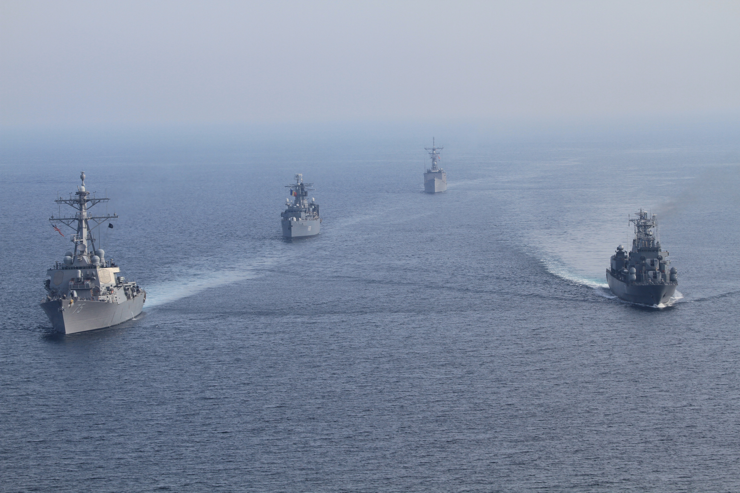 USS Donald Cook (DDG 75) and the guided-missile frigate USS Taylor (FFG 50) participate in a bilateral underway engagement with Romanian ships, the frigate ROS Regina Maria (F 222) and the frigate ROS Marasesti (F 111) in the Black Sea in April 2014. US Navy Photo