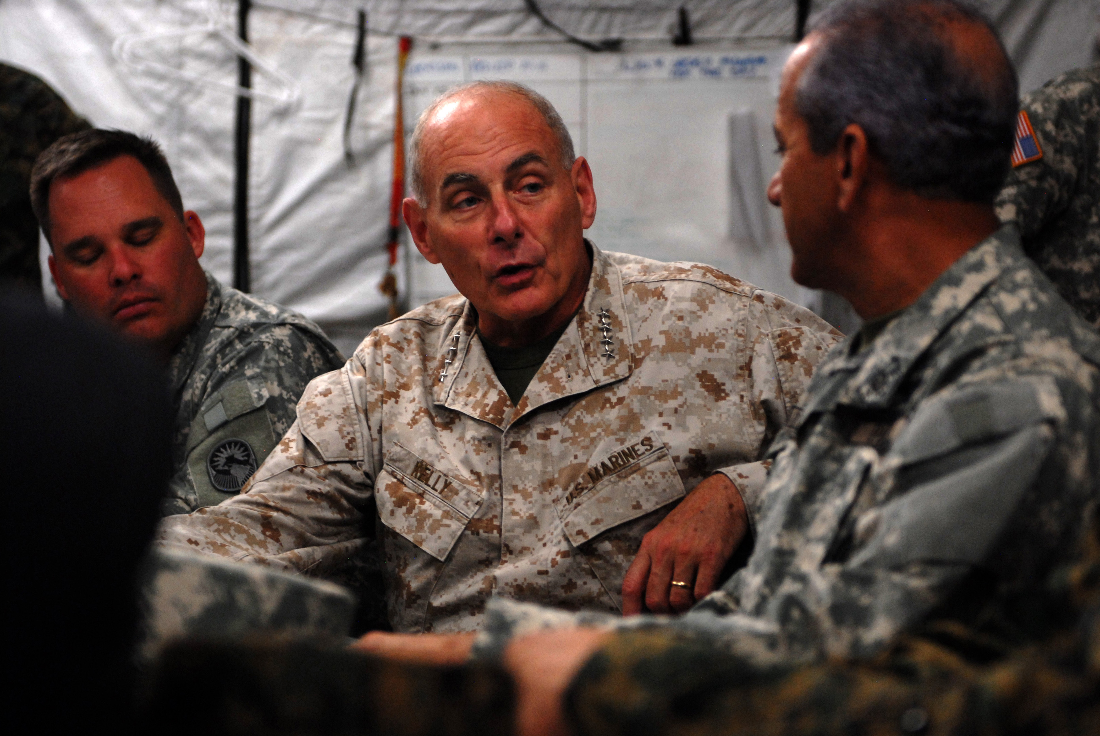 Marine Corps Gen. John F. Kelly, center, commander of U.S. Southern Command, speaks with Adm. Sigifrido Pared Perez, Dominican Republic minister of defense, in Barahona, Dominican Republic on June 9, 2014. SOUTHCOM Photo