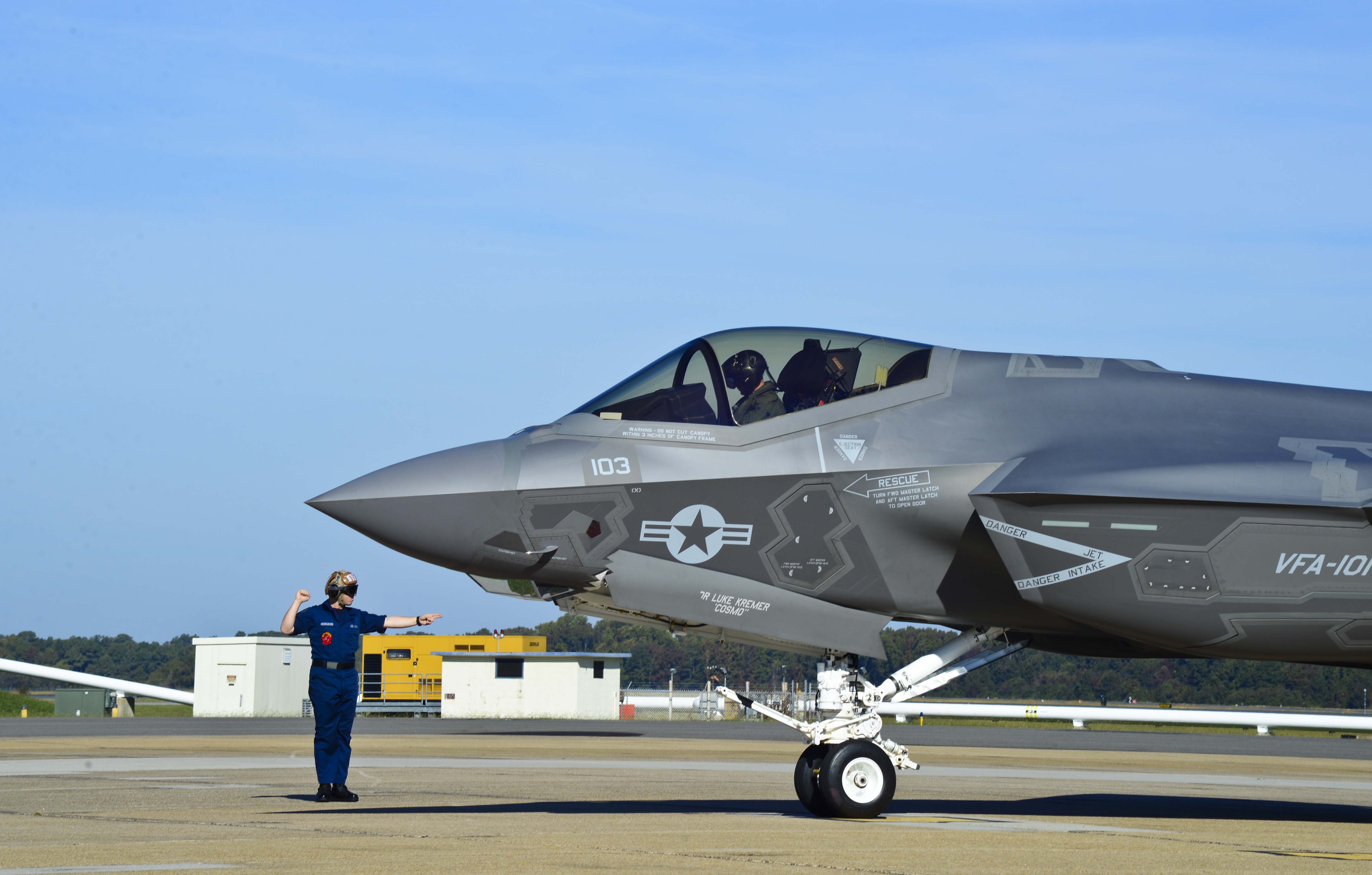Lt. Scott Cleveland, assigned to Strike Fighter Squadron (VFA) 101, is directed to park the F-35C Lightning II Joint Strike Fighter after landing at Naval Air Station Oceana. US Navy Photo