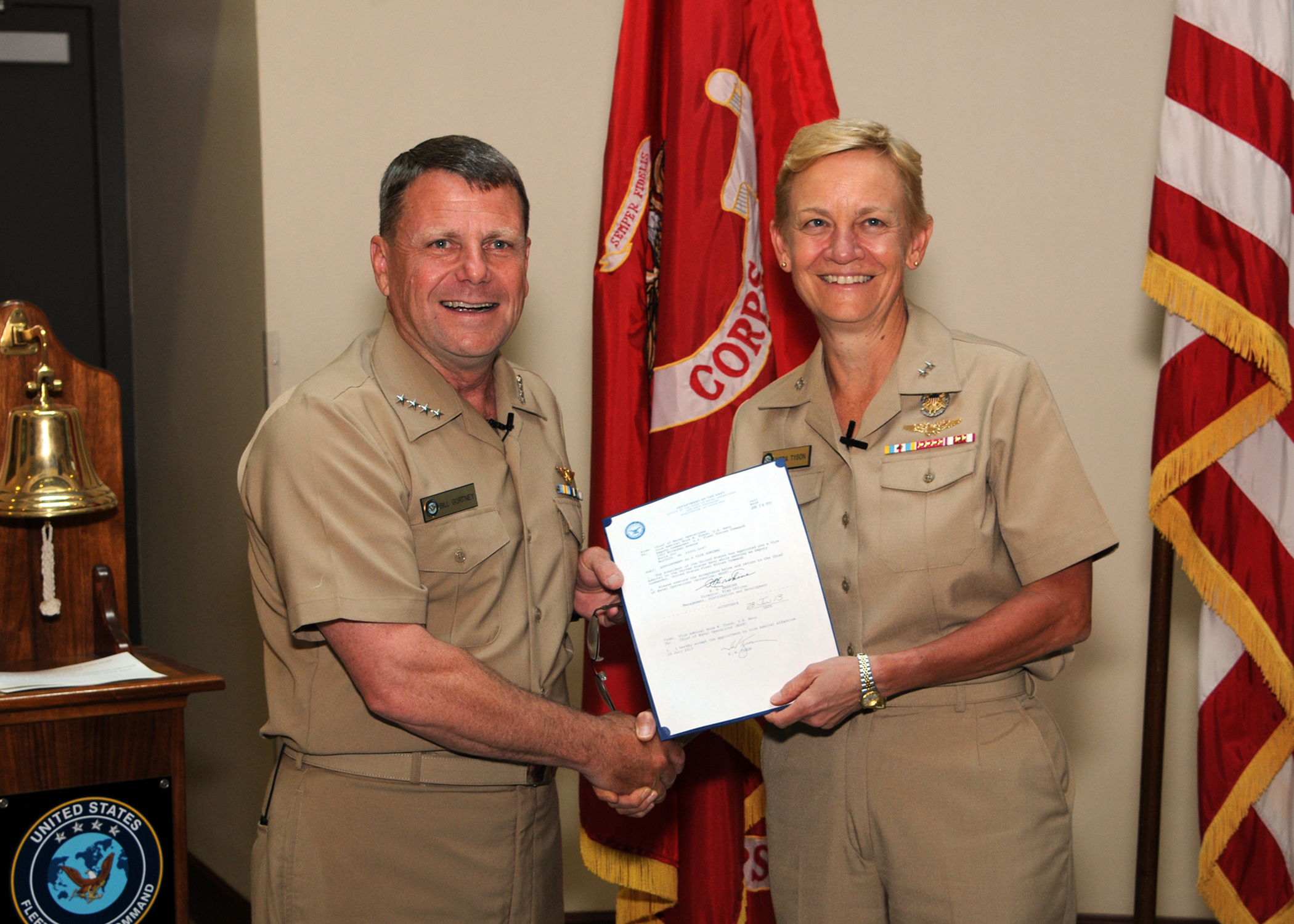 Vice Adm. Nora W. Tyson (right) and Adm. Bill Gortney, commander U.S. Fleet Forces (USFF) hold a letter authorizing her to put on a third star during a promotion ceremony in 2013. US Navy Photo