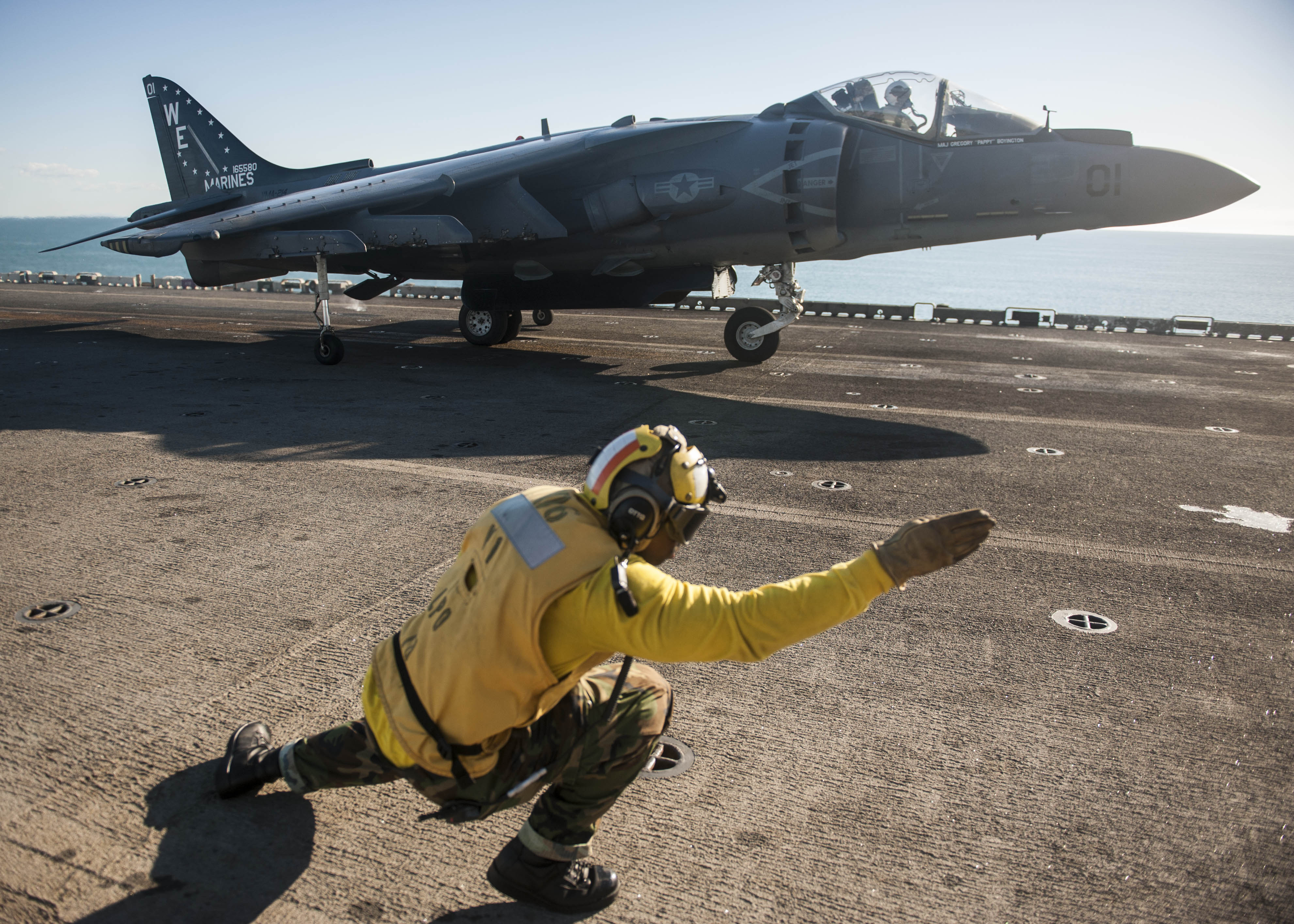 An AV-8B Harrier from the Black Sheep of Marine Attack Squadron (VMA) 214 on the flight deck of the amphibious assault ship USS Bonhomme Richard (LHD-6) on Aug. 4, 2013. US Navy Photo