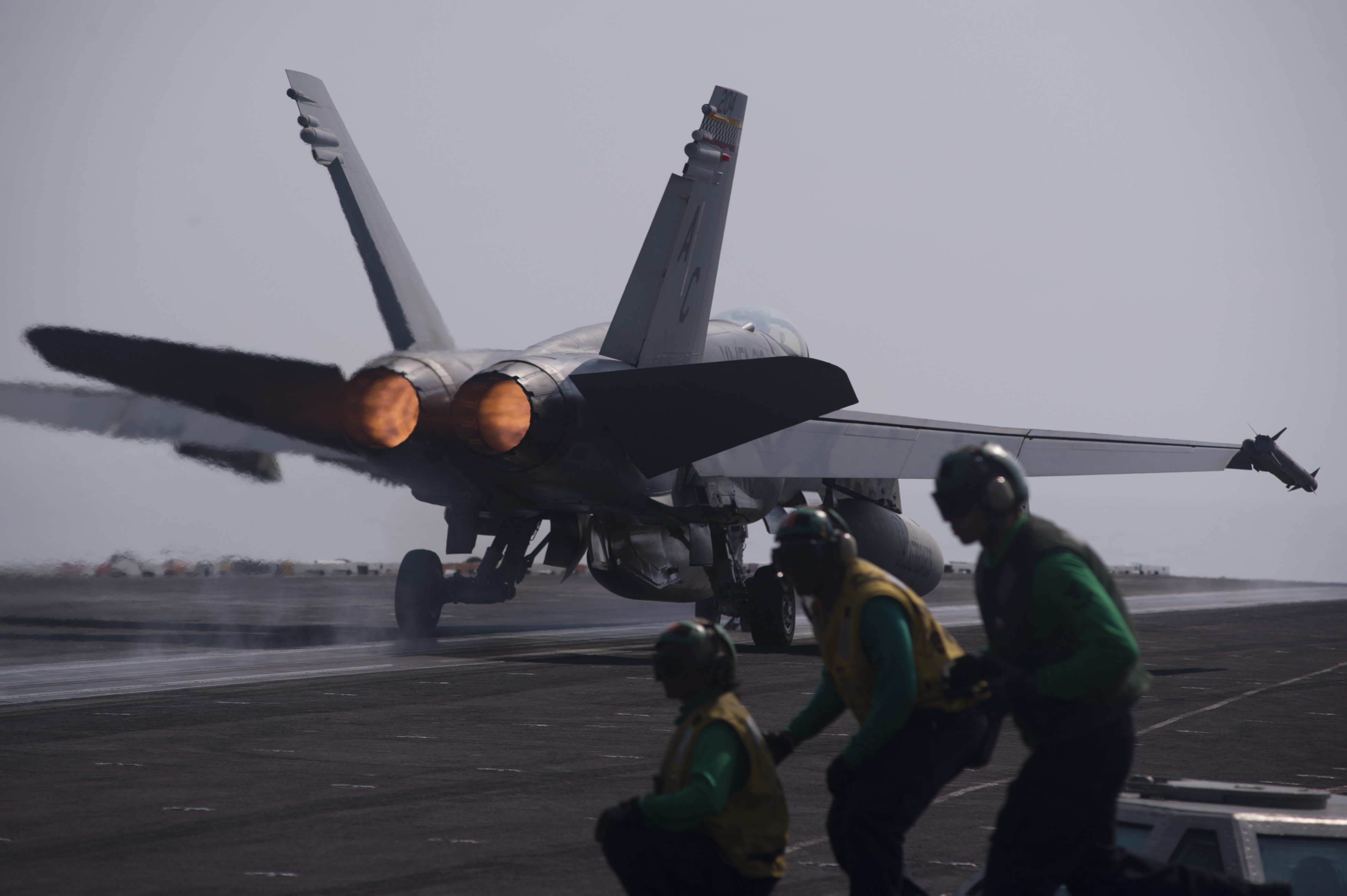 An F/A-18C Hornet, assigned to the Checkerboards of Marine Fighter Attack Squadron (VMA) 312, launches from the flight deck of the aircraft carrier USS Harry S. Truman (CVN-75) on Oct. 13, 2014. US Navy Photo