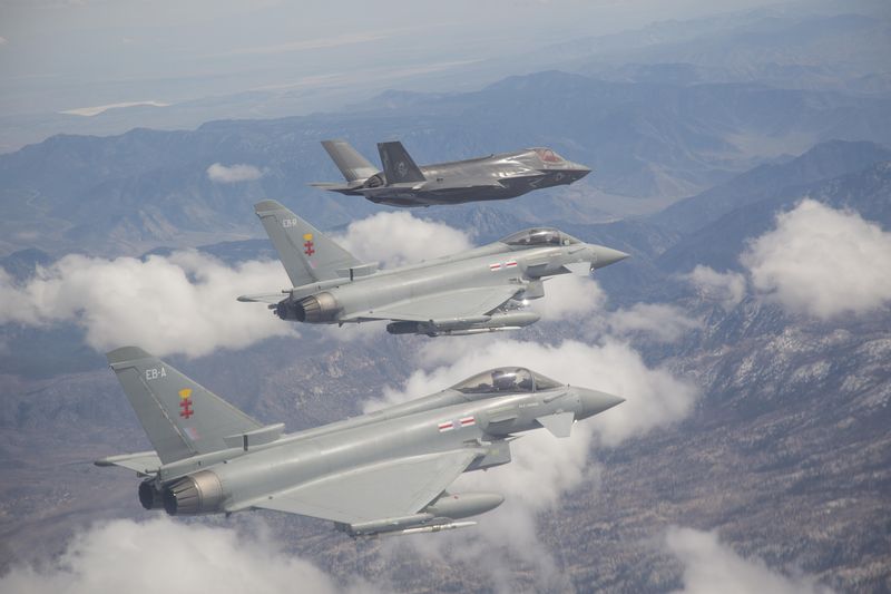 F-35 BF-17 from the F-35 Integrated Test Force in Formation with RAF Typhoons, Edwards AFB, Calif. April 4, 2014. DoD Photo