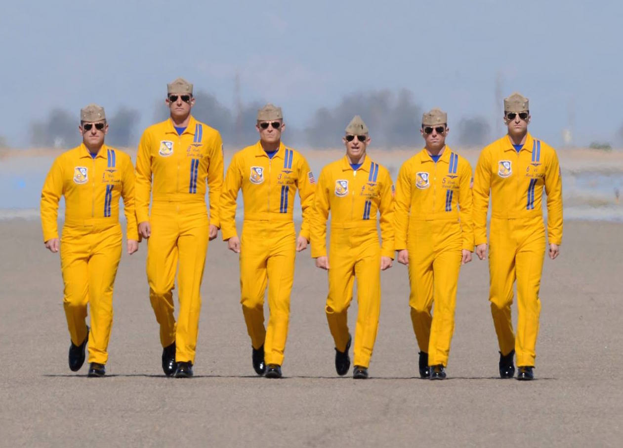 The Blue Angels jet pilots in throwback gold flight suits during a March, 15 2014 pre-flight walk. US Navy Photo