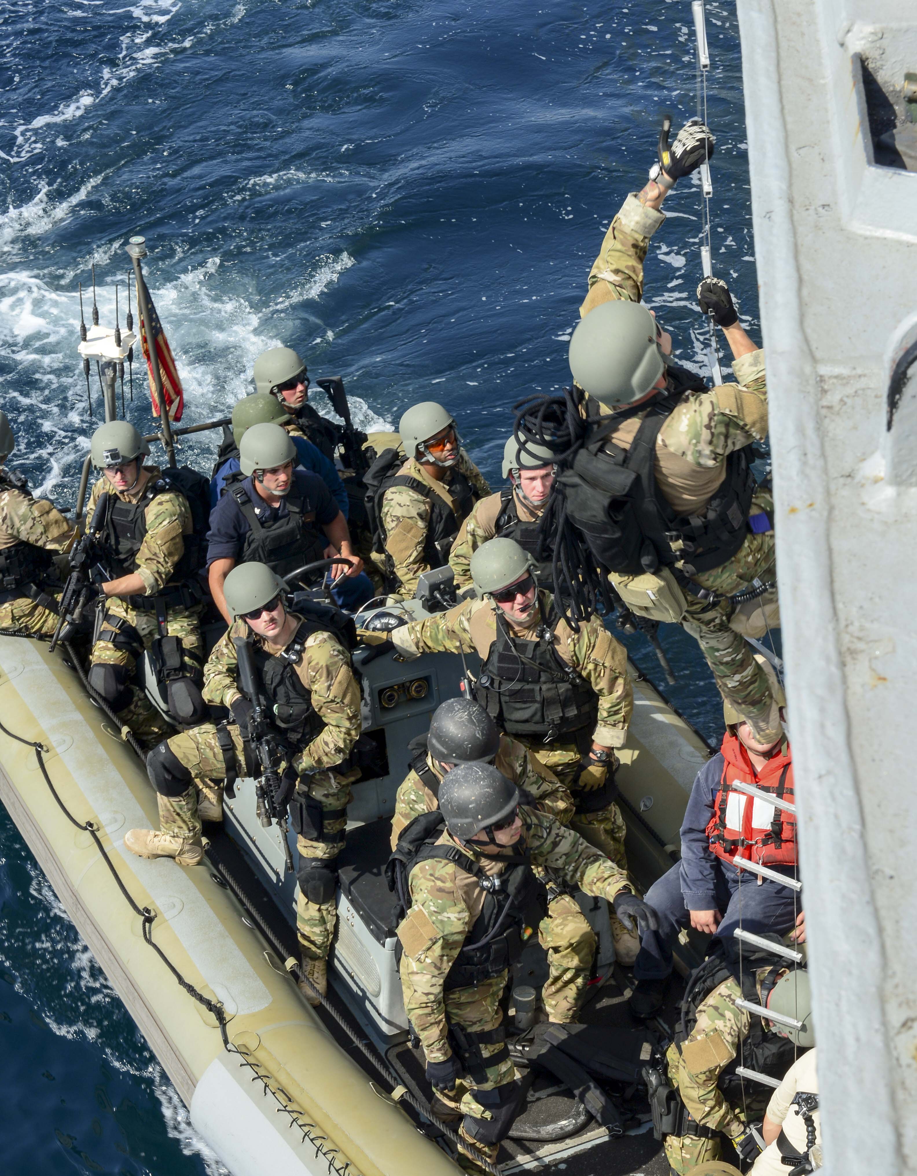 Visit, board, search and seizure team members pull alongside the Arleigh Burke-class guided-missile destroyer USS Sterett (DDG-104) to practice ship boarding. US Navy Photo