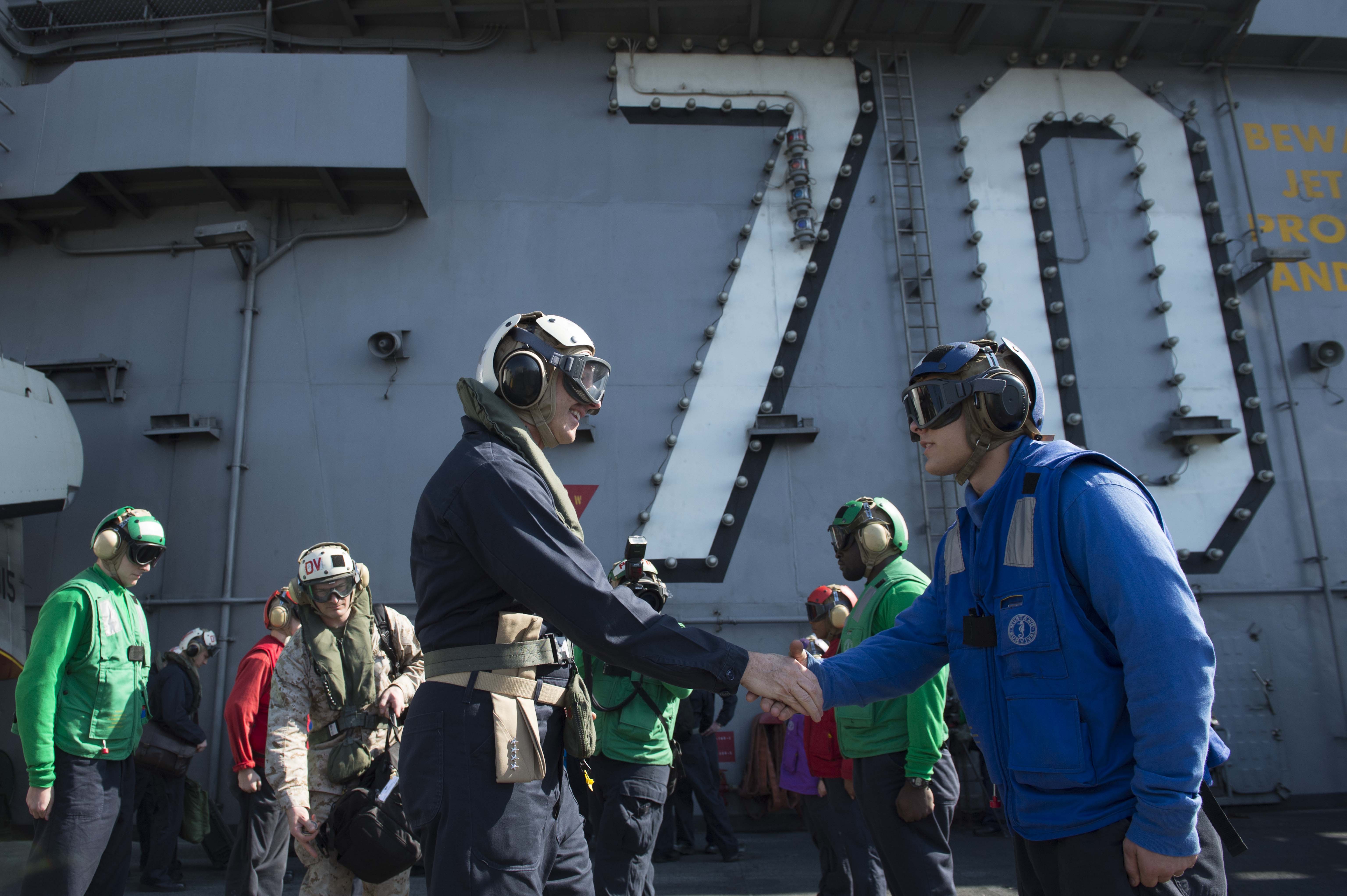 Chief of Naval Operations (CNO) Adm. Jonathan Greenert is welcomed aboard the aircraft carrier USS Carl Vinson (CVN 70) on Nov. 27, 2014. US Navy Photo