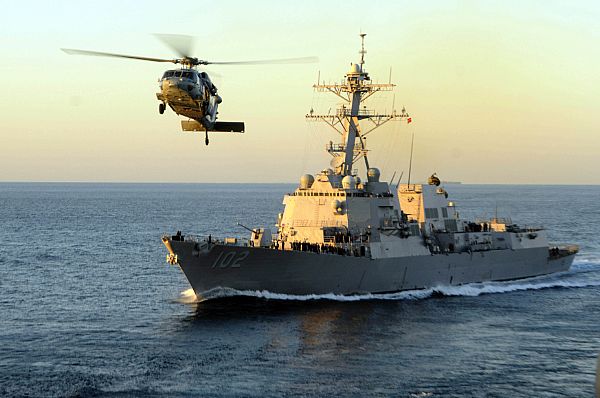 USS Sampson (DDG-102) and an MH-60S Sea Hawk in 2010. US Navy Photo