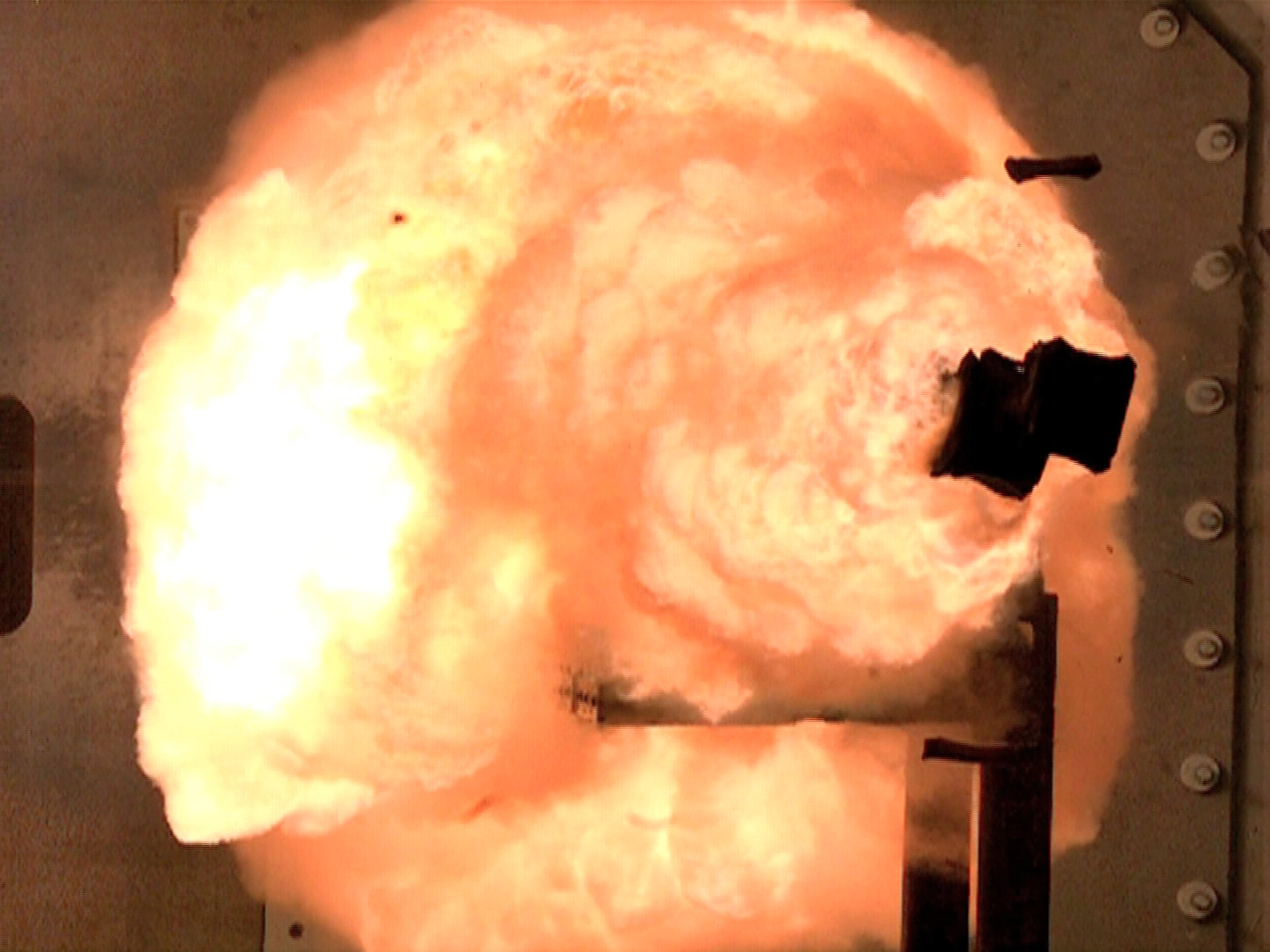  A high-speed camera captures the first full-energy shots from the Office of Naval Research-funded electromagnetic railgun prototype launcher in 2012. US Navy Photo