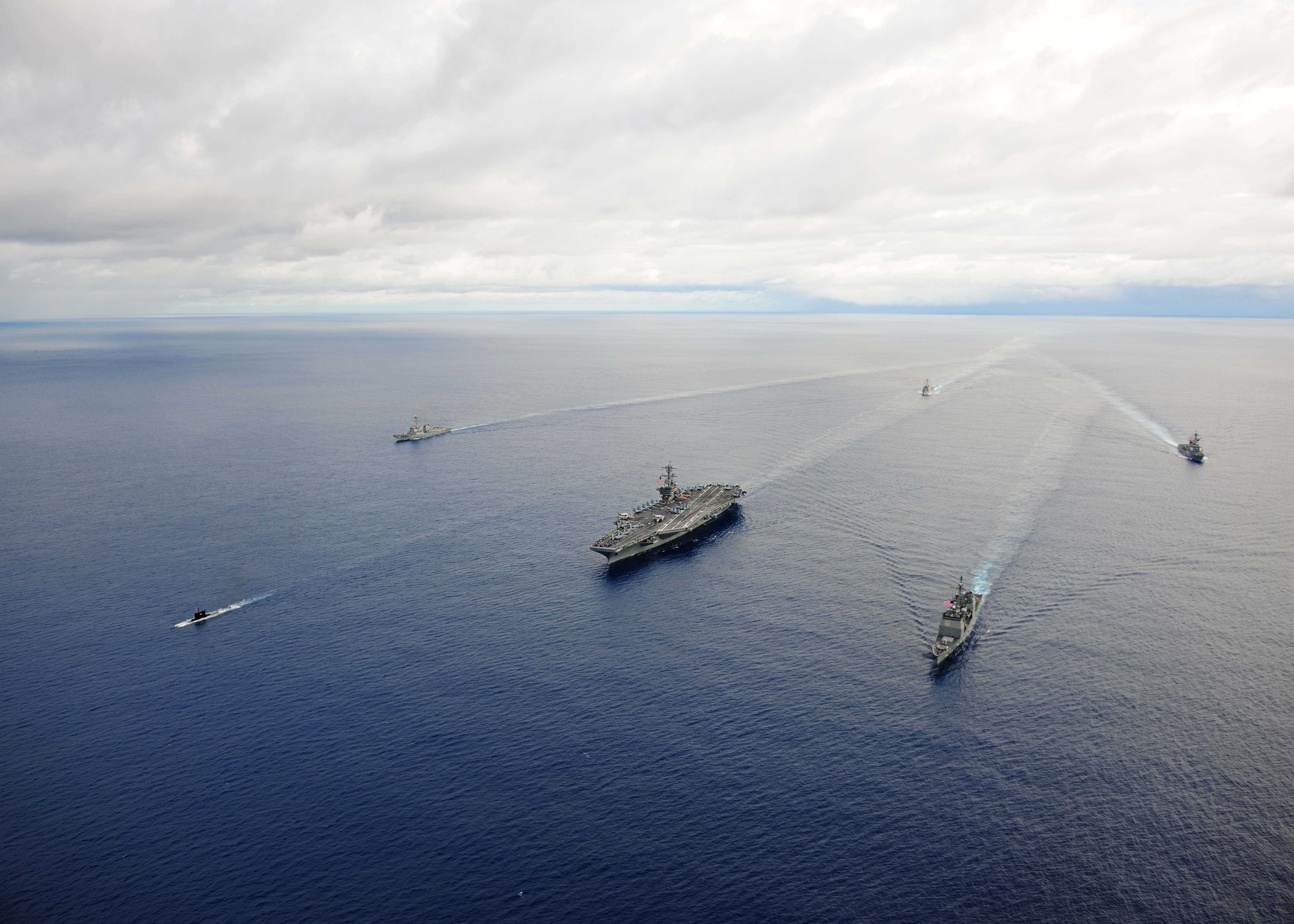 USS Theodore Roosevelt (CVN 71) leads ships from Carrier Strike Group (CSG) 12 during a maneuvering exercise on Sept. 23, 2014. US Navy Photo