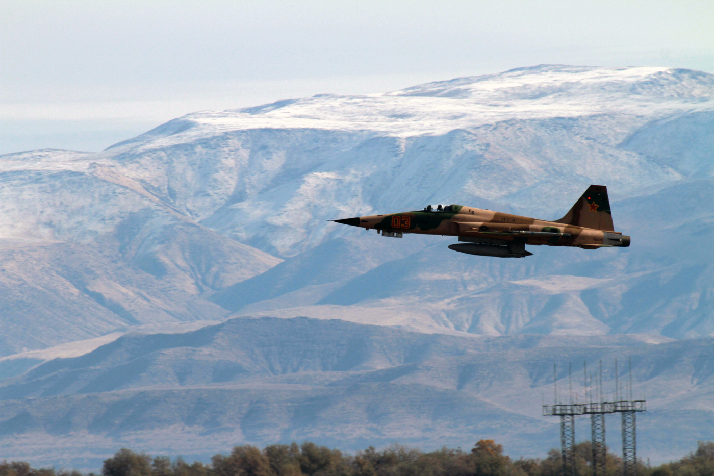 An F-5 Tiger II from the Saints of Fighter Squadron Composite (VFC) 13 takes off from a runway on Naval Air Station Fallon on Nov. 4, 2014. US Navy Photo